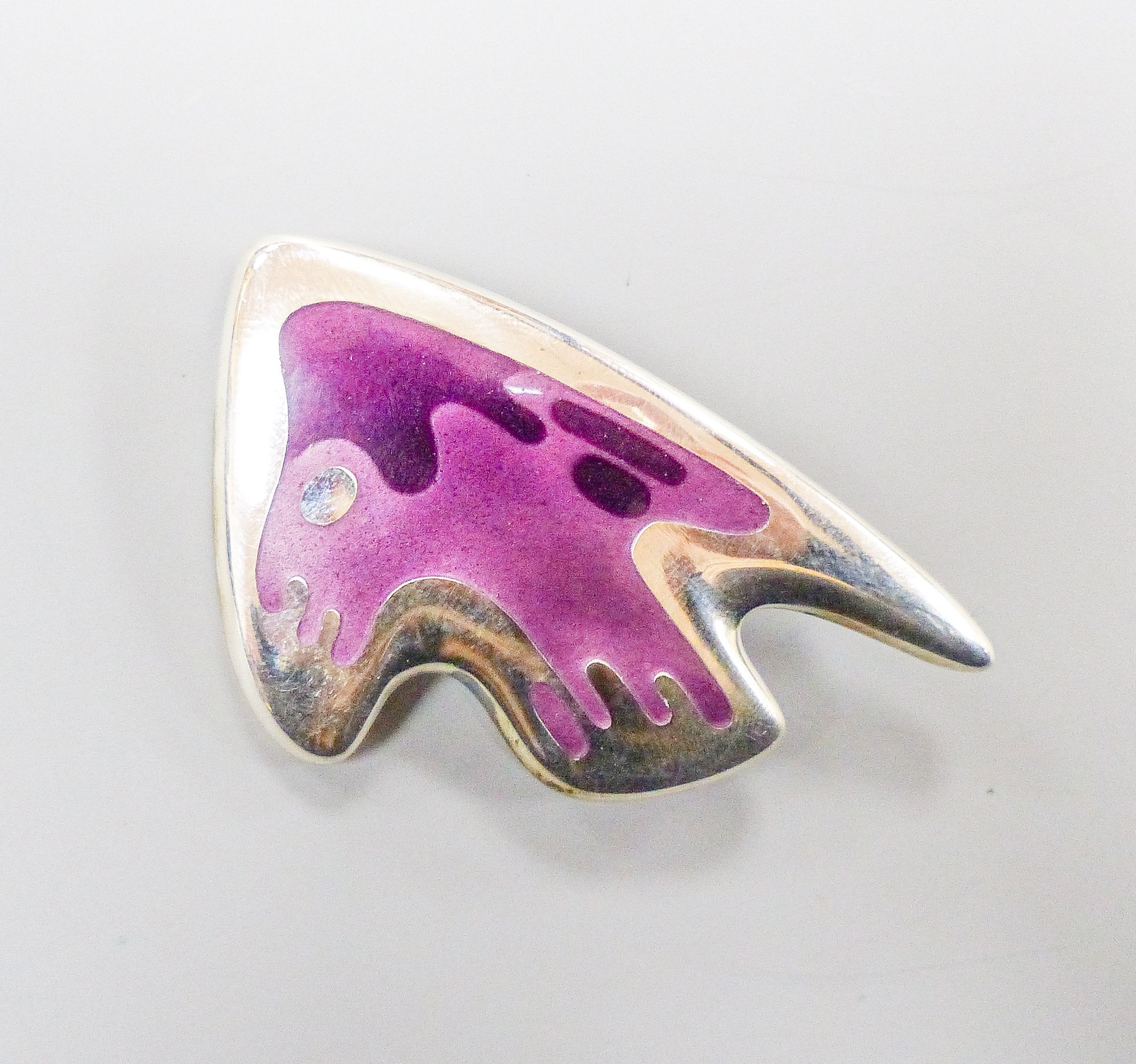 A Henning Koppel for Georg Jensen sterling and two colour mauve enamel stylised fish brooch, no. 307, 61mm.